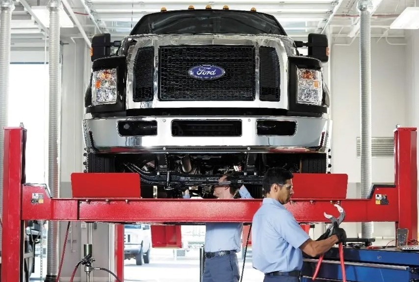 Commercial Ford Truck on air lift being serviced
