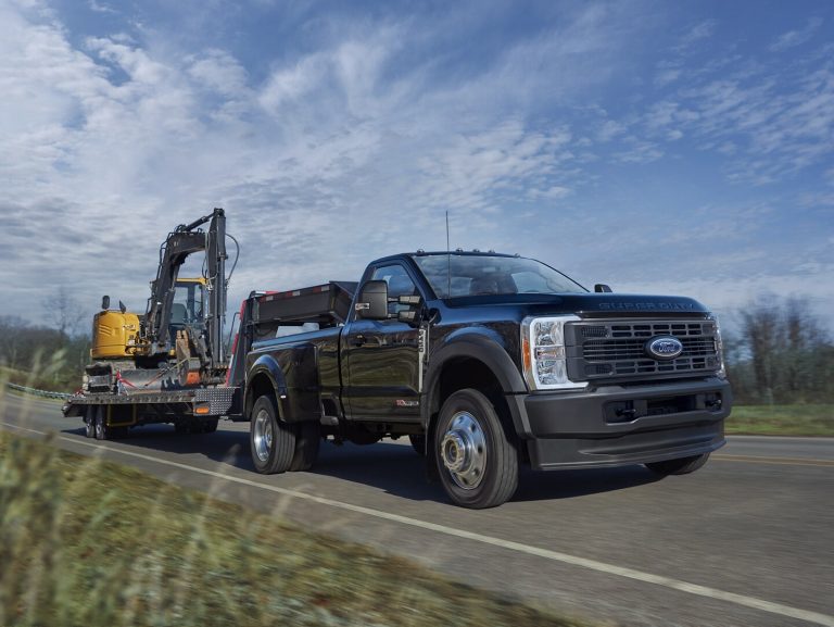 2024 Ford Super Duty towing excavator.